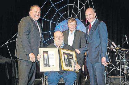 WorkSafe Tasmania Awards 2014 overall winner Ken Ewington (centre), from Powerlinestas, accompanied by (from left) WGL consultant Bill Lee, GIO Insurance representative Michael Charman and Treasurer Peter Gutwein.